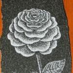Granite Etching of Rose. This piece uses traditional pointilism to define all the countours & shadows. A typical motif for monuments.