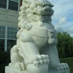 60" Oriental Male Lion Statue holding a sphere.