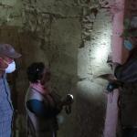 Examining walls in KV-10 Chamber C.